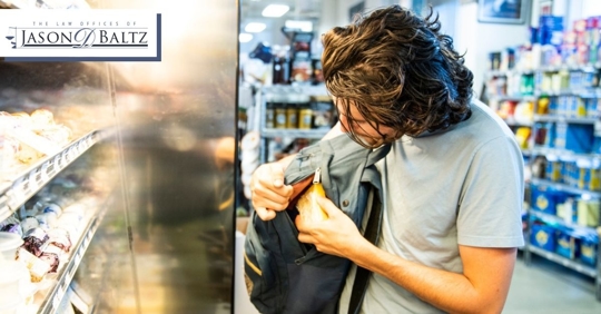 Man shoplifting at a grocery store