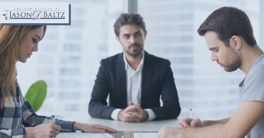 couple across a table with a mediator between them